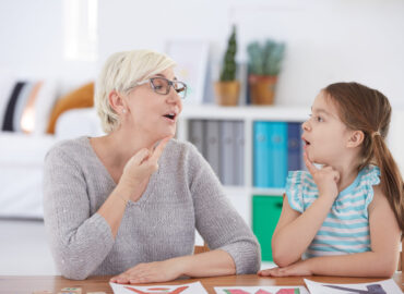 Child receiving speech therapy to improve communication and language skills