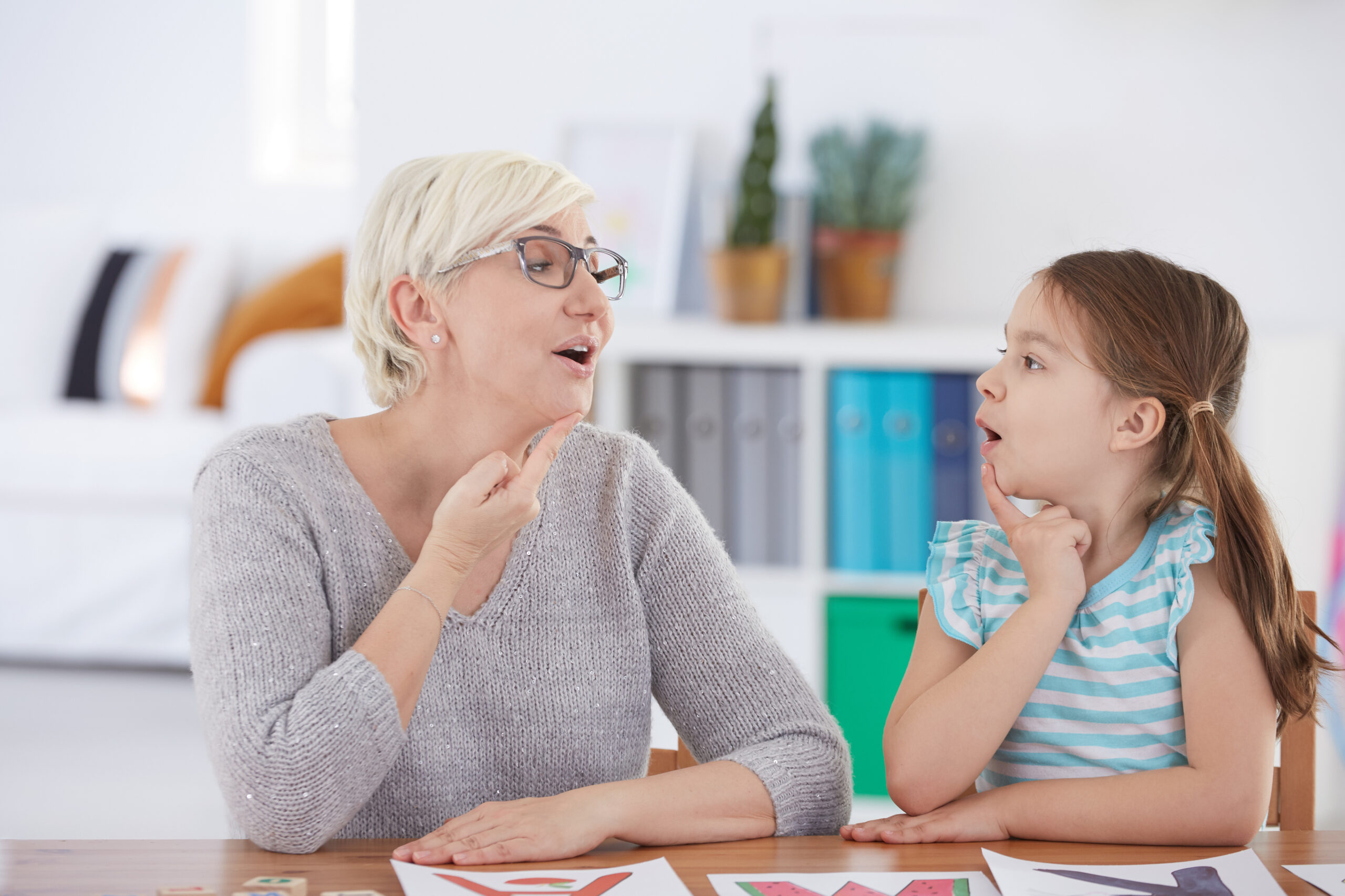 Child receiving speech therapy to improve communication and language skills